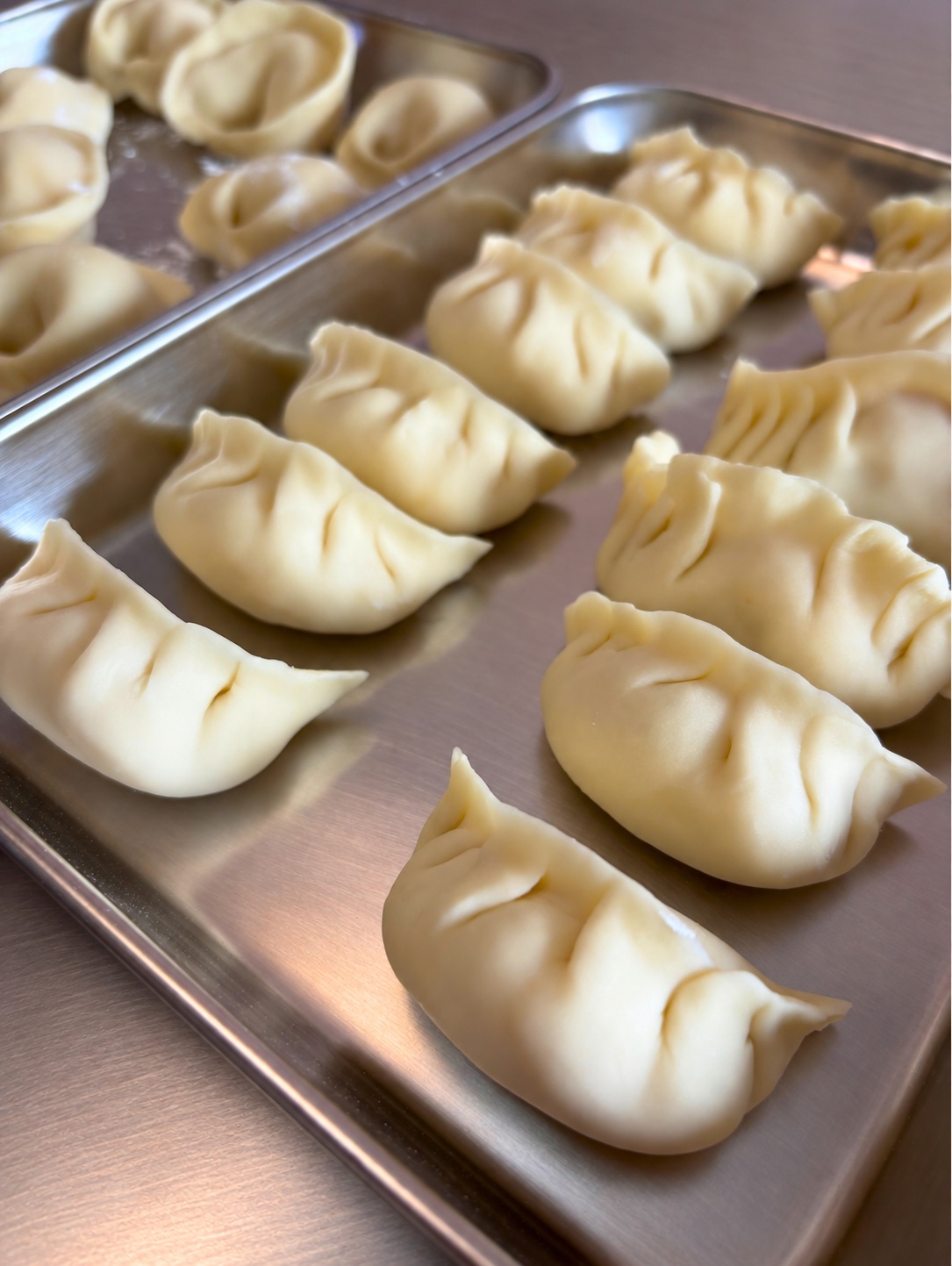 Fresh handmade dumplings prepared during a WOKTOPIA cooking class