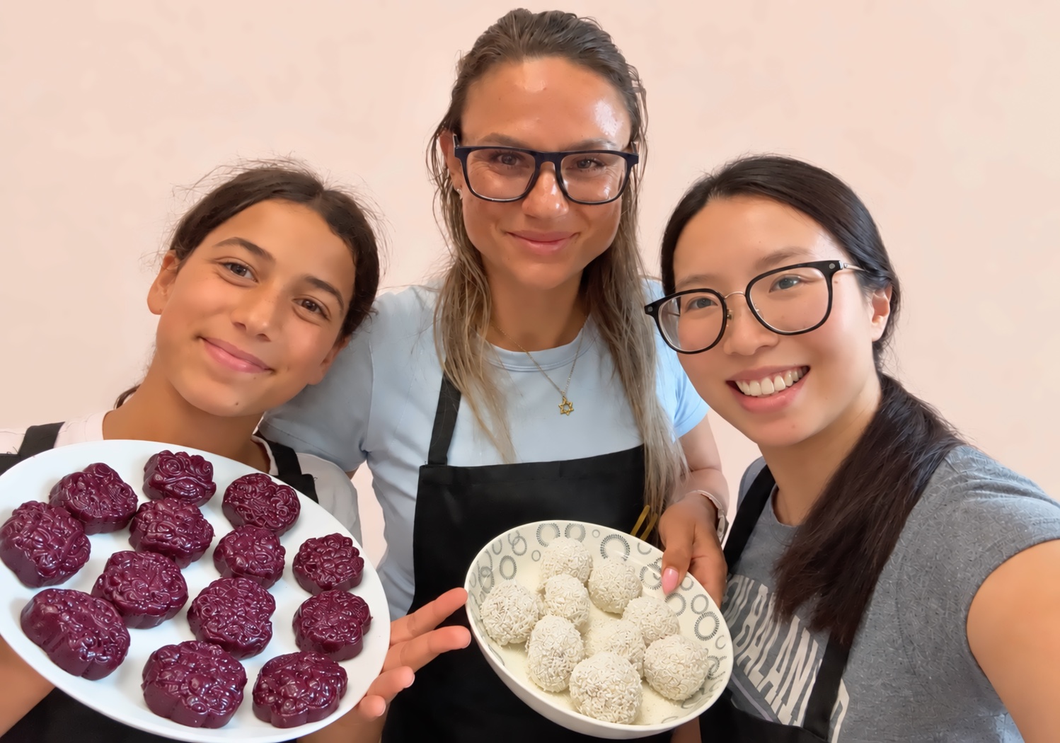 Guests showing handmade coconut mochi at WOKTOPIA Cooking Class